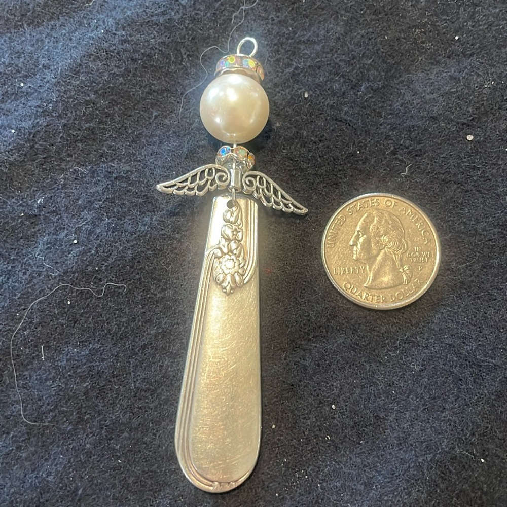 Handmade ornate silver angel pendant/ornament.